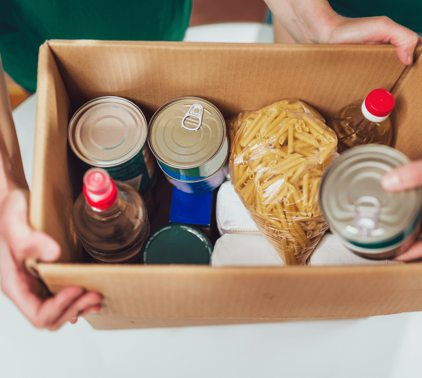 Box of canned food and pasta.